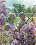 Couple Smiles and Tends to Garden in Beverly Hills, Florida, G by Skip Gandy