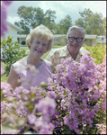 Couple Smiles and Tends to Garden in Beverly Hills, Florida, J by Skip Gandy