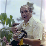 Man Plays Guitar Poolside in Beverly Hills, Florida, C by Skip Gandy