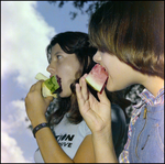 Teenager and Child Eat Watermelon Slices in Beverly Hills, Florida, A by Skip Gandy