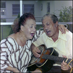 Couple Sings and Plays Guitar Together in Beverly Hills, Florida, A by Skip Gandy