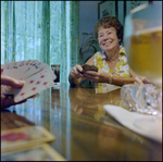 Portrait of Woman Smiling While Playing Cards in Beverly Hills, Florida, D by Skip Gandy