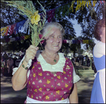 Woman in Traditional Dress Holds Floral Garland at German American Social Club Festival in Beverly Hills, Florida, A by Skip Gandy