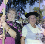 Two Women Smile While Holding Maypole at German American Social Club Festival in Beverly Hills, Florida by Skip Gandy