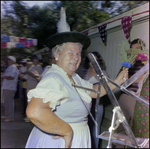 Woman in Traditional Dress Holds Floral Garland at German American Social Club Festival in Beverly Hills, Florida, B by Skip Gandy