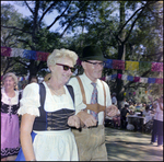 Couple Smiles With Arms Linked at German American Social Club Festival in Beverly Hills, Florida by Skip Gandy