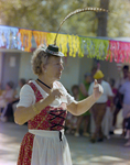 Woman Dances in Long Feathered Hat at German American Social Club Festival in Beverly Hills, Florida, F by Skip Gandy