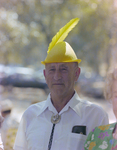 Man in Traditional Yellow Hat at German American Social Club Festival in Beverly Hills, Florida, A by Skip Gandy