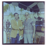 Two Men Shake Hands at Burnt Store Marina Seafood Festival in Punta Gorda, Florida by Skip Gandy