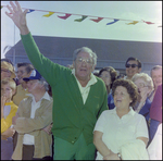 Man in Crowd Waves at Burnt Store Marina Seafood Festival in Punta Gorda, Florida by Skip Gandy