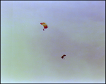 Two Paragliders Fly Above Burnt Store Marina Seafood Festival in Punta Gorda, Florida by Skip Gandy