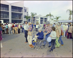 Woman in Wheelchair Eats Cake at Burnt Store Marina Seafood Festival in Punta Gorda, Florida by Skip Gandy