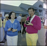 Couple Holding Two Digital Cameras at Burnt Store Marina Seafood Festival in Punta Gorda, Florida, A by Skip Gandy