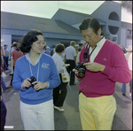 Couple Holding Two Digital Cameras at Burnt Store Marina Seafood Festival in Punta Gorda, Florida, B by Skip Gandy