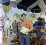 Staff Member Addresses Crowd at Burnt Store Marina Seafood Festival in Punta Gorda, Florida by Skip Gandy