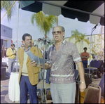 Man in Paisley Shirt Addresses Crowd at Burnt Store Marina Seafood Festival in Punta Gorda, Florida by Skip Gandy