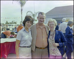 Two Women Stand Beside Man for Picture at Burnt Store Marina Seafood Festival in Punta Gorda, Florida, A by Skip Gandy