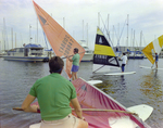 Four Windsurfers Sail at Burnt Store Marina Seafood Festival in Punta Gorda, Florida, A by Skip Gandy