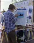 Artist Draws Freehand Whale Illustration on Shirt at Burnt Store Marina Seafood Festival in Punta Gorda, Florida by Skip Gandy