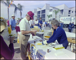 Staff Members Serve Food at Burnt Store Marina Seafood Festival in Punta Gorda, Florida, D by Skip Gandy