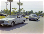 Line of Cars Enter Burnt Store Marina Seafood Festival in Punta Gorda, Florida by Skip Gandy