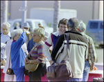 Friends Chat During Burnt Store Marina Seafood Festival in Punta Gorda, Florida by Skip Gandy