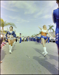 Baton Twirlers Follow Student Marching Band During Burnt Store Marina Seafood Festival in Punta Gorda, Florida, A by Skip Gandy