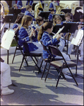 School Band Plays in Folding Chairs at Burnt Store Marina Seafood Festival in Punta Gorda, Florida, A by Skip Gandy