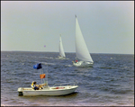 Aquasport, Anchored in the Water As Sailboats Pass by, Burnt Store Marina Seafood Festival in Punta Gorda, Florida, A by Skip Gandy