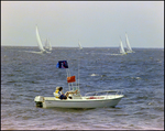 Aquasport, Anchored in the Water As Sailboats Pass by, Burnt Store Marina Seafood Festival in Punta Gorda, Florida, F by Skip Gandy