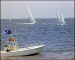 Aquasport, Anchored in the Water As Sailboats Pass by, Burnt Store Marina Seafood Festival in Punta Gorda, Florida, I by Skip Gandy