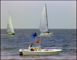 Aquasport, Anchored in the Water As Sailboats Pass by, Burnt Store Marina Seafood Festival in Punta Gorda, Florida, K by Skip Gandy