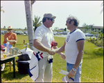 Two Men Shaking Hands, Burnt Store Marina Seafood Festival, Punta Gorda, Florida by Skip Gandy