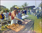 Two Men Cooking on Grill As Others Wait in Line, Burnt Store Marina Seafood Festival, Punta Gorda, Florida, B by Skip Gandy