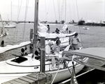 Three Men on a Sailboat Looking at Maps, Tampa, Florida, B by George Skip Gandy IV