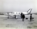 Business Executives Preparing to Board a Piper Navajo Private Plane, Tampa, Florida, D by George Skip Gandy IV