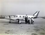 Business Executives Preparing to Board a Piper Navajo Private Plane, Tampa, Florida, O by George Skip Gandy IV