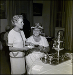 Mrs. Eliot Fletcher and Mrs. Leland Carlton Serving Tea at Community Concert Association Birthday Event, Tampa, Florida, B by George Skip Gandy IV