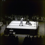 Referee Standing Over Men Grappling in Wrestling Ring, Tampa, Florida by George Skip Gandy IV