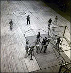 Harlem Globetrotters and the Washington Generals Watching Basketball Enter Hoop, Tampa, Florida, A by George Skip Gandy IV