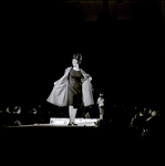 Woman Holding Open Coat on Runway, Tampa, Florida by George Skip Gandy IV