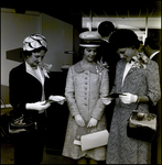 Women Looking at Booklets, Tampa, Florida by George Skip Gandy IV