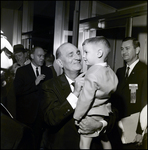 Nick Nuccio Holding a Boy, Tampa, Florida by George Skip Gandy IV