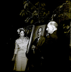 Nick Nuccio and Lila Hixon Standing by Painting, Tampa, Florida by George Skip Gandy IV