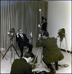 Man Holding Cigar and Flag While Being Filmed, Tampa, Florida by George Skip Gandy IV