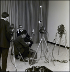 Man Holding Cigar and Flag in Front of Cameras, Tampa, Florida by George Skip Gandy IV