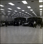 People Sitting at Banquet Tables and Walking Around, Tampa, Florida by George Skip Gandy IV