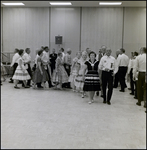 Couples Walking in a Line, Tampa, Florida, B by George Skip Gandy IV