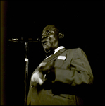 Louis Armstrong Speaking into Microphone and Holding a Rag, Tampa, Florida, A by George Skip Gandy IV