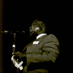 Louis Armstrong Speaking into Microphone and Holding a Rag, Tampa, Florida, B by George Skip Gandy IV